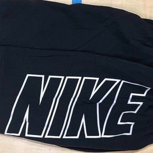 Men's NIKE swim trunks, size medium, Black.